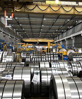 Sheet metal rolls in warehouse
